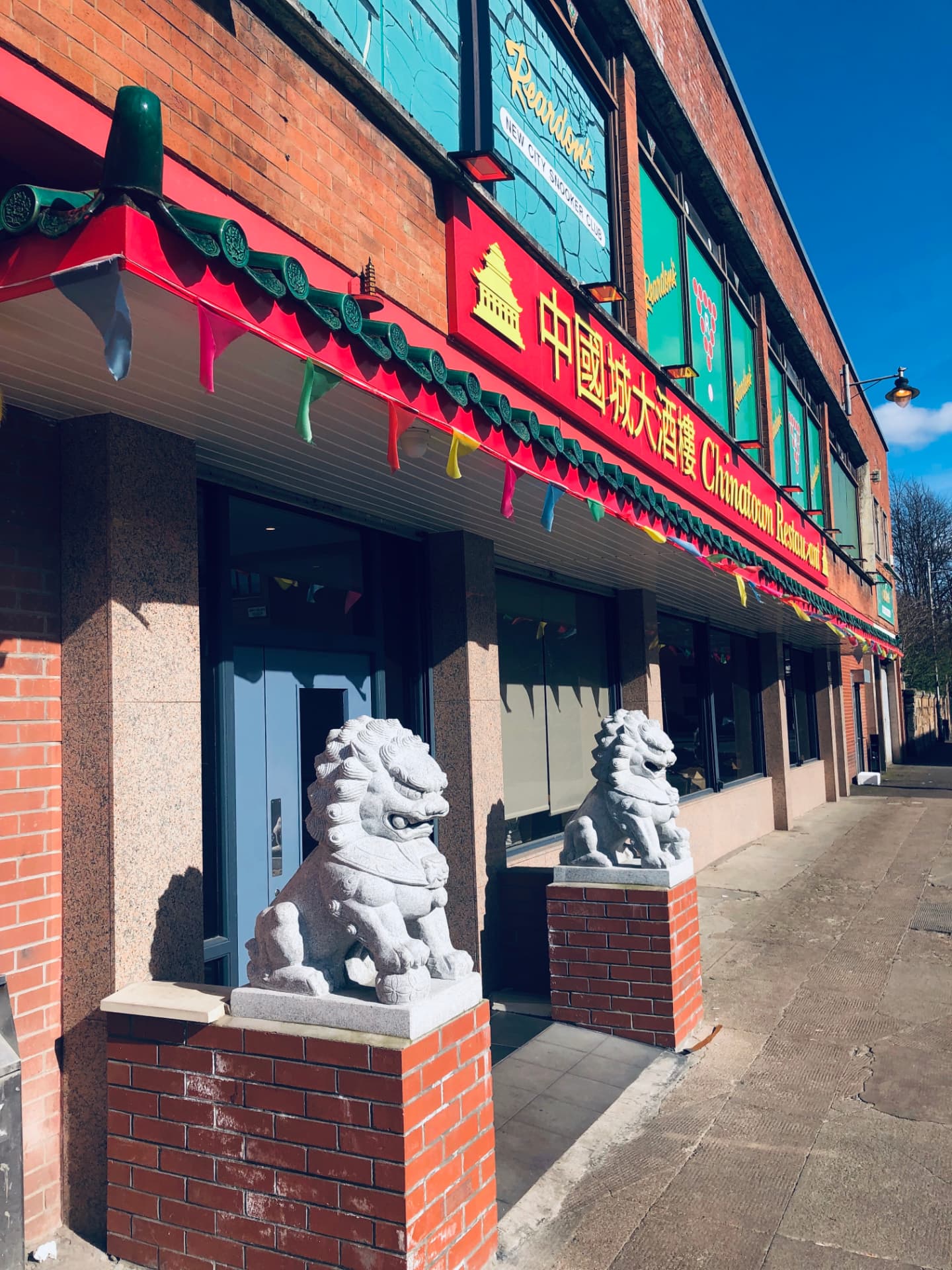 Stone guardian lions at the entrance of Chinatown Restaurant Glasgow